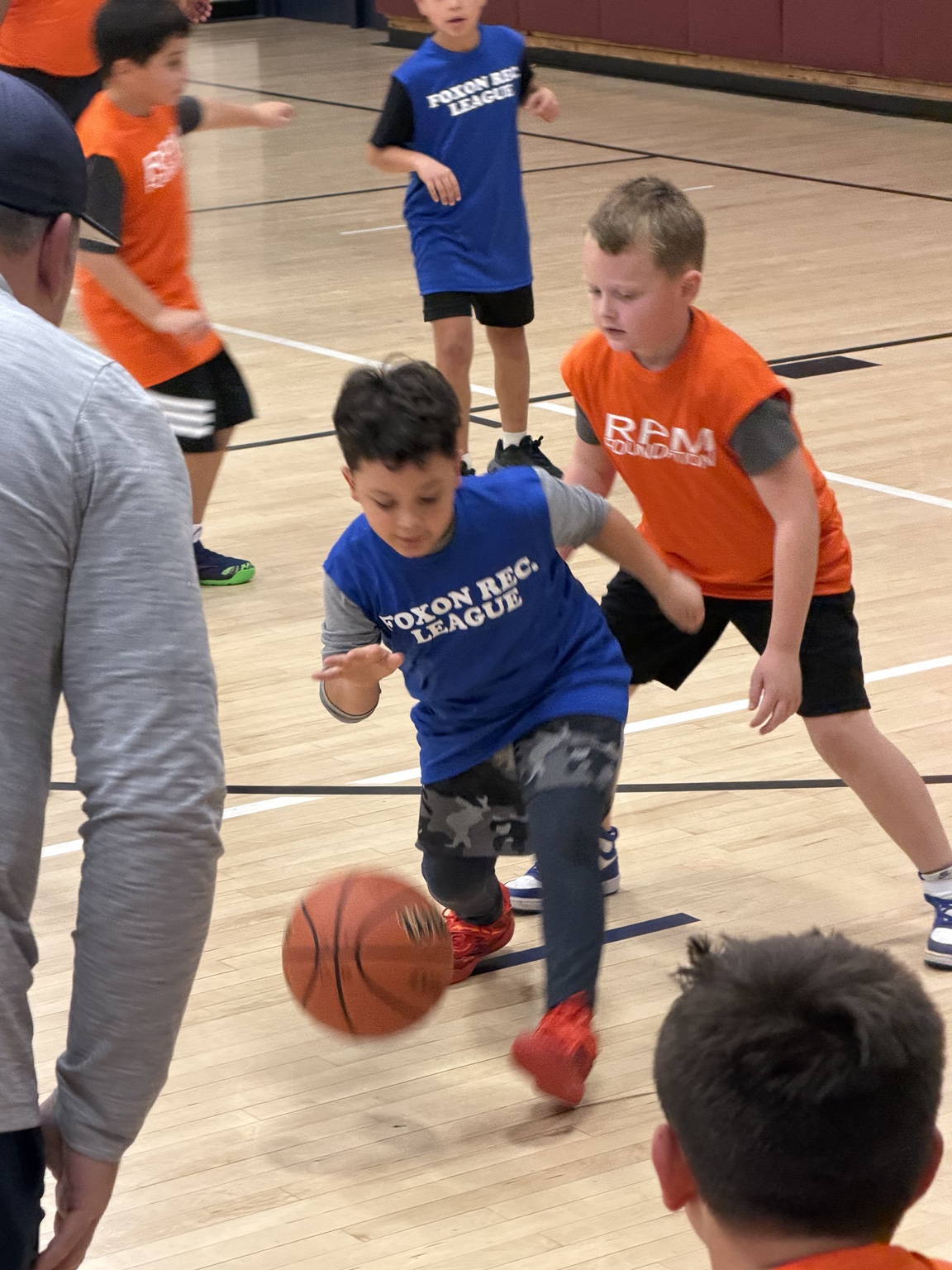 Youth basketball player competing during a Sal Tinari Biddy Basketball game